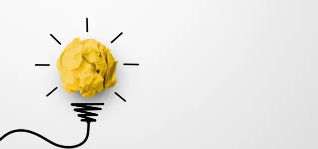 Paper scrap ball yellow colour with light bulb symbol